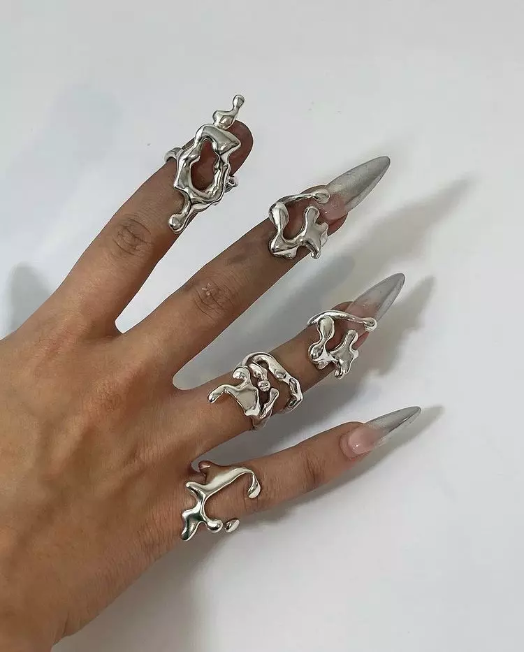 Silver Acrylic Nails With a Twist